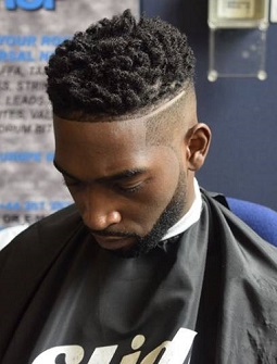 Tinie Tempah: The Twist-Up: The style is called a “twisted box top”, with a “low fade” at the sides, clean edging around the hairline and a fade-up beard shape.