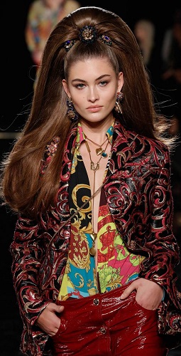 Grace Elizabeth stepped out onto  the catwalk. Atop her head a high ponytail that could only be described as gravity-defying - packed with so many hair extensions it towered a good many inches above her own natural hairline and cascaded almost to her waist. 