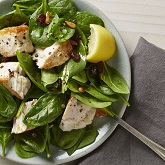 Swordfish with Spinach, Golden Raisins, and Pine Nuts