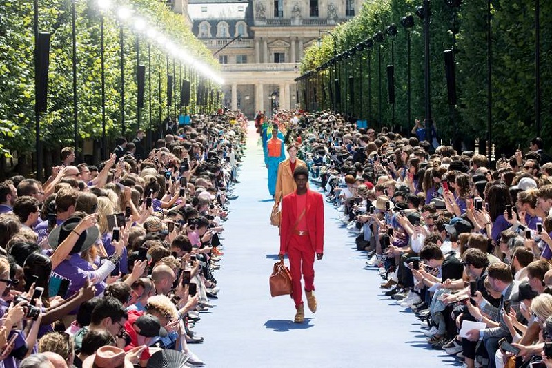 The Off-White founder introduced his vision for Louis Vuitton with a rainbow-infused catwalk show outside Paris' Palais-Royal, 21 June 2018